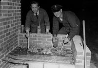 Men cooking on grill 